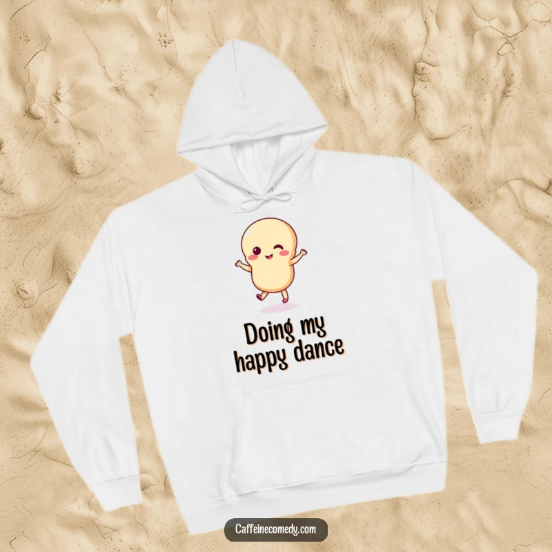 Funny macaron hoodie depicting a happy macaron character performing an energetic, tiny dance, offering warmth and whimsical charm.