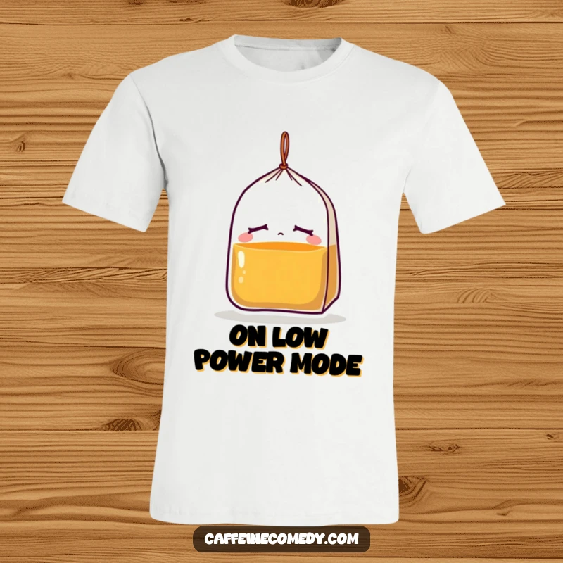 Funny t-shirt featuring a sleepy tea bag character with closed eyes and a drooping string, conveying extreme tiredness and relaxation.